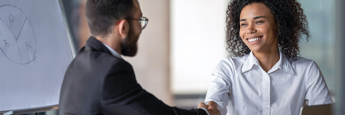 two workers shaking hands about sap investment managing module