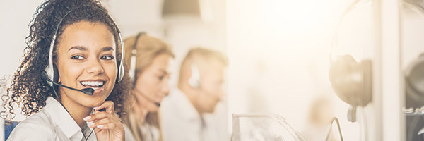 woman on the phone with a customer helping with ebs support