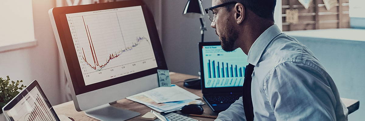 man working on his desktop with data lakes