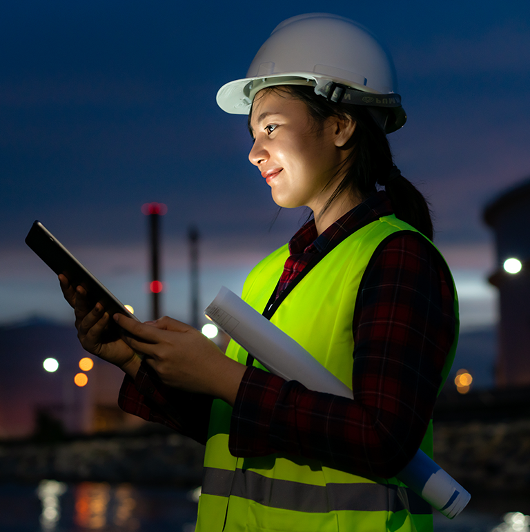 Woman scanning a mining operations report.